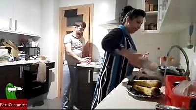 She wants to gobble her banana in the kitchen. He runs on top of her