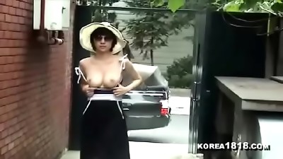 Sexy Korean Mummy shows her tits in public